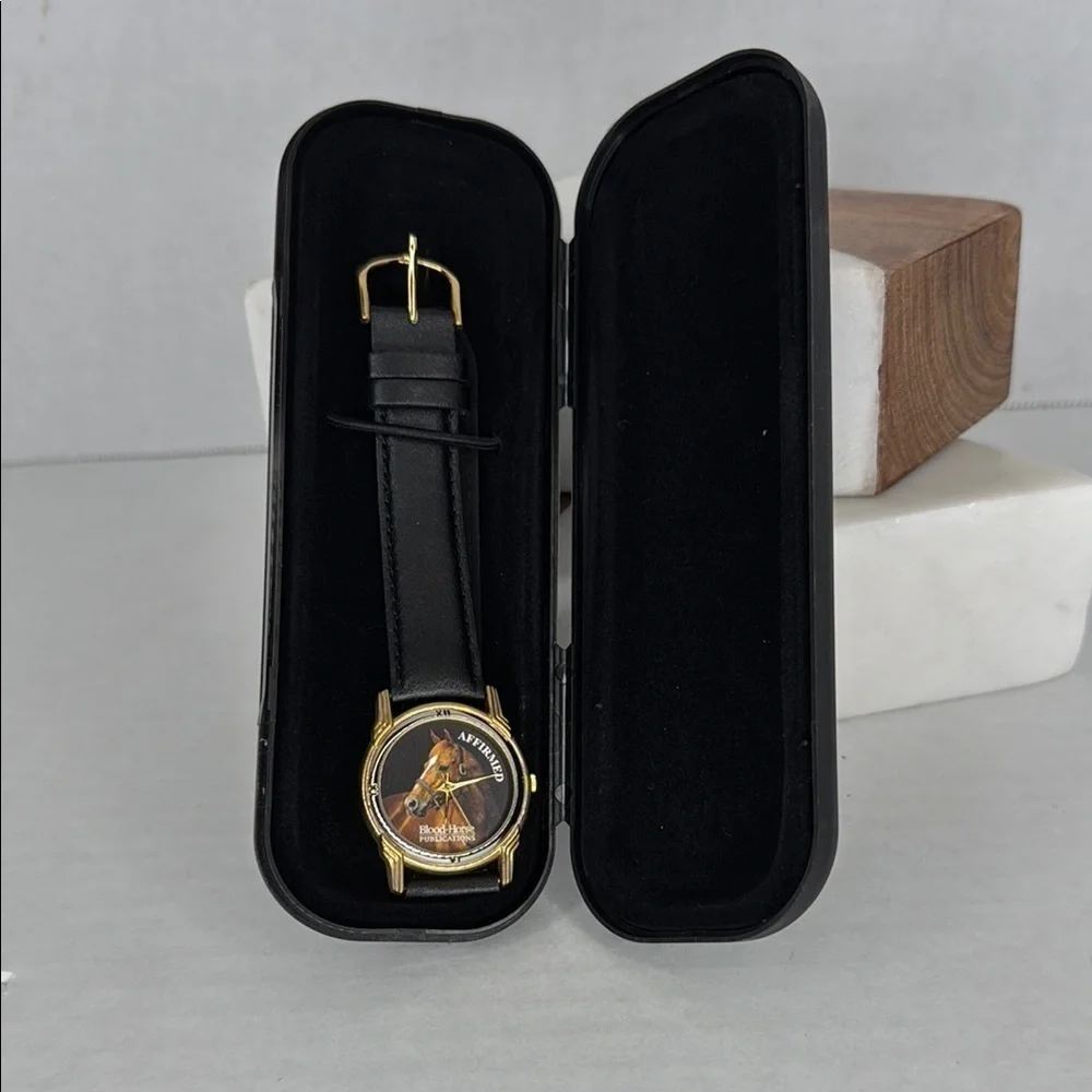 Vintage Affirmed Black and Gold Watch with Horse Design lot W2